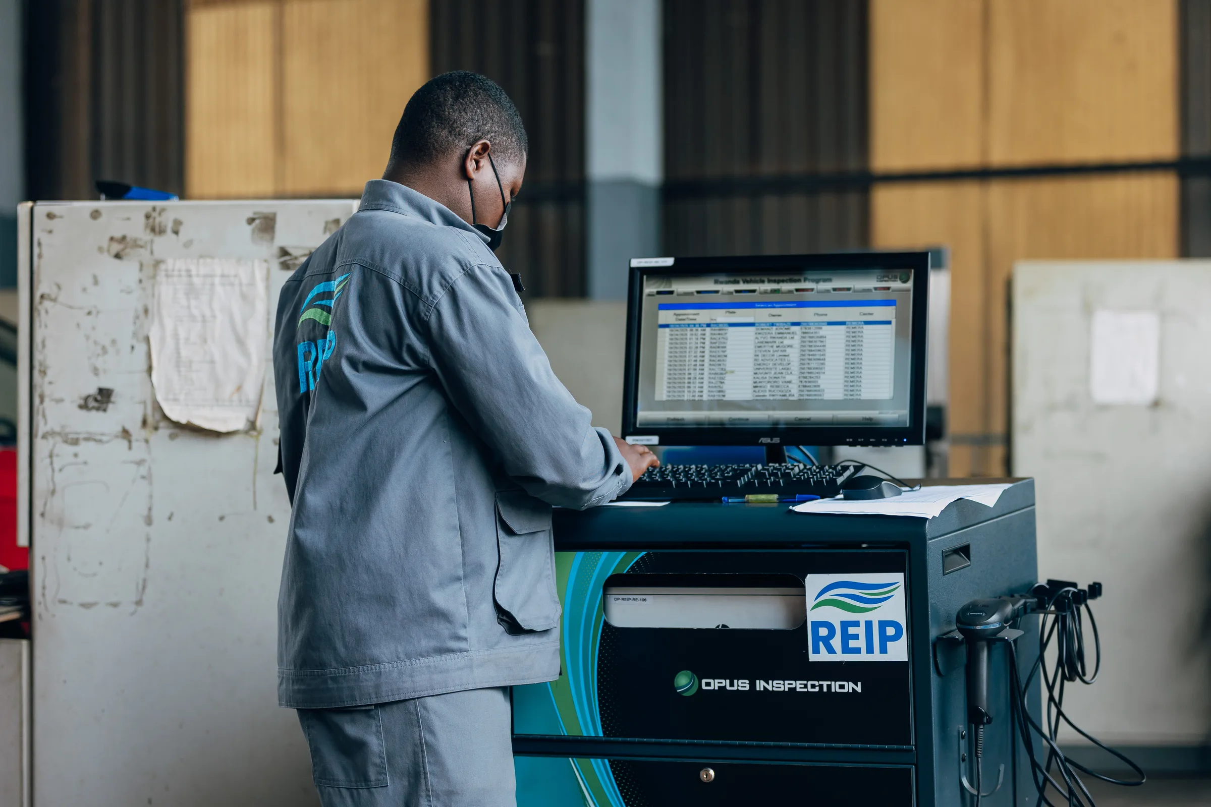 A REIP inspector recording vehicle results in the inspection database