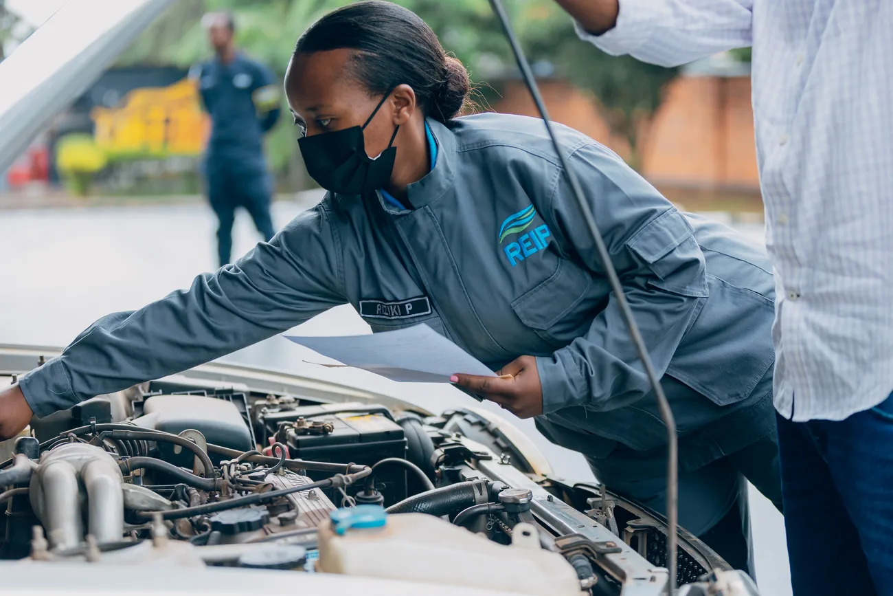 REIP technicians working at an engine bay